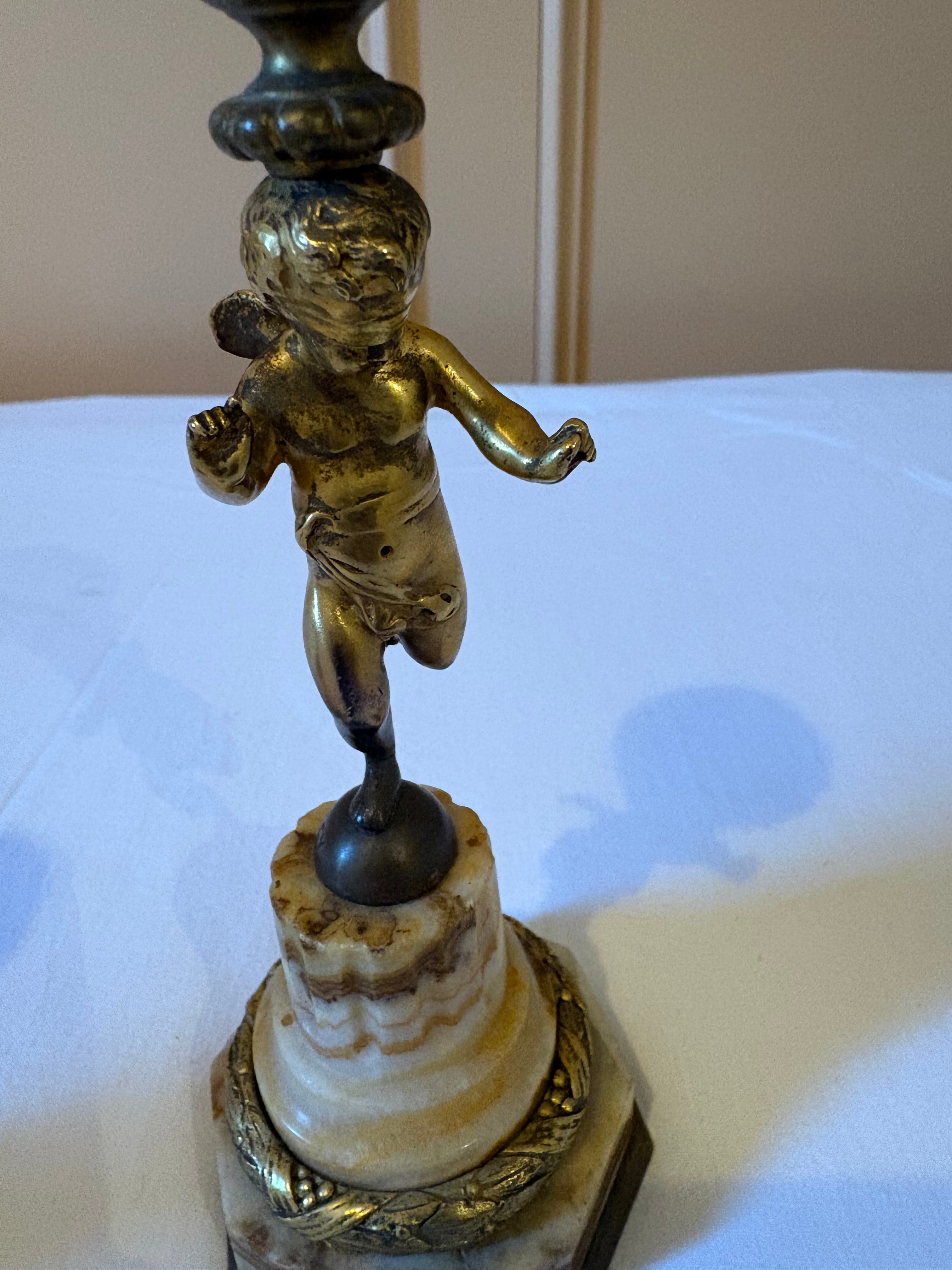 Antieke kandelaars met figuur van cherubijn 19 eeuw